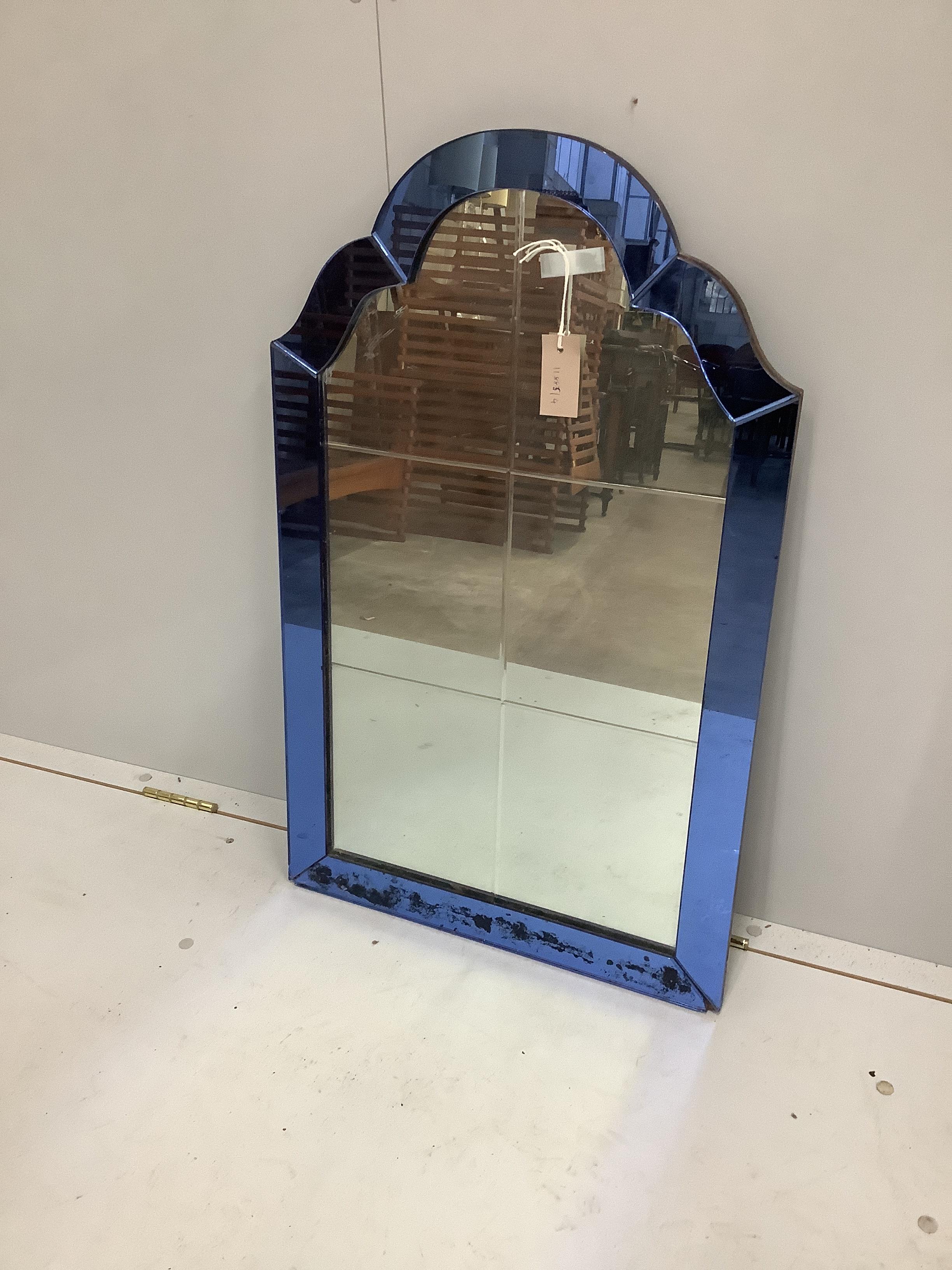 An Art Deco style wall mirror with blue glass border, width 51cm, height 81cm